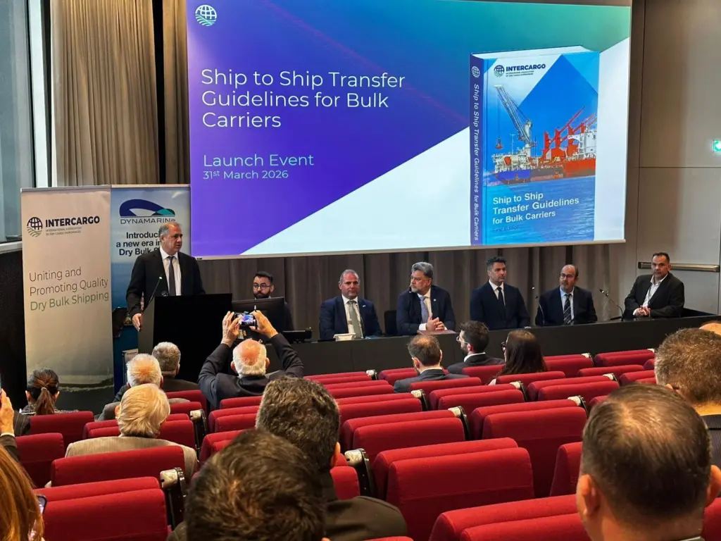 Representatives from INTERCARGO discussing dry bulk ship-to-ship transfer guidelines at an event in Athens