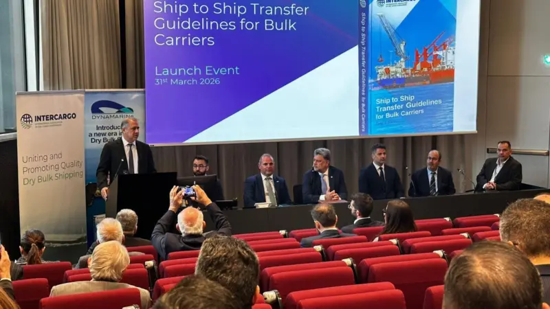 Representatives from INTERCARGO discussing dry bulk ship-to-ship transfer guidelines at an event in Athens