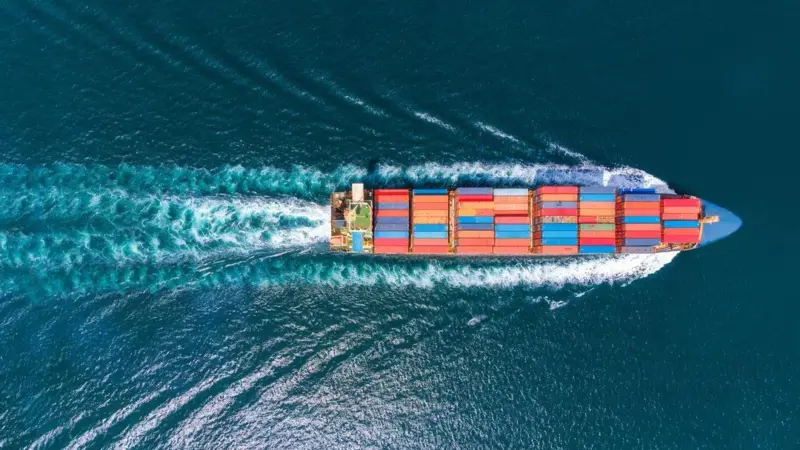 Overhead image of a container ship at sea