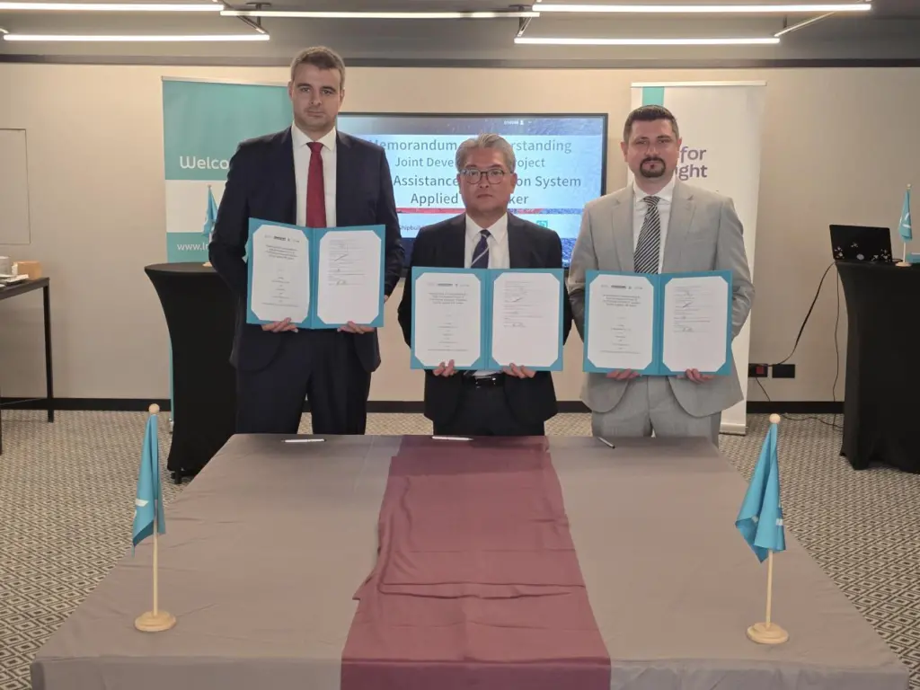 Employees of LR, K Shipbuilding and Liberian Registry at an MoU signing to develop wind propulsion for MR tankers
